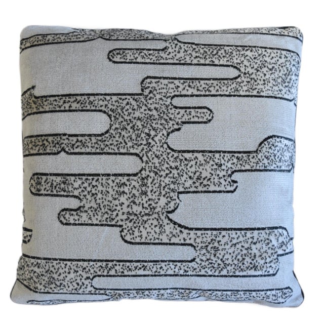 A custom-tailored pillow by Mike Seratt of The Prized Pig in designer Romo Textiles "Salvador" velvet fabric depicts a...