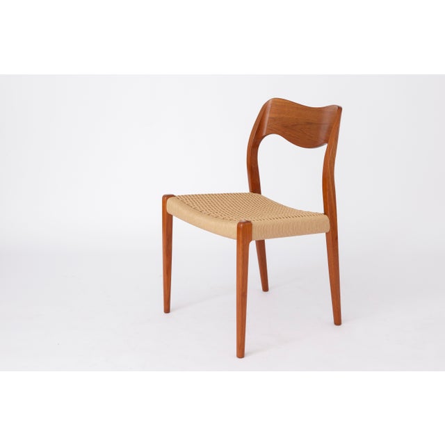 Niels Otto Møller Model 71 Dining Chair, Denmark, 1950s. An iconic Scandinavian modern chair featuring a solid teak wood...
