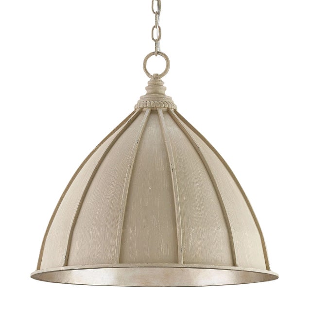 While a lovely oyster cream finish on the exterior of the Fenchurch Pendant makes it a study in distressing, the silver...