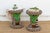 Look past the beadwork for a second and you'll see what's actually holding these stools up: a carved leopard figure on...