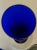 Fabulous vintage deep blue glass bud vase with clear glass base. The sleek, simple design is timeless. In excellent...