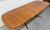 This listing is for a Vintage Danish Modern Teak Oval Dining Table. Featuring an oval top, two hideaway leaves that expand...