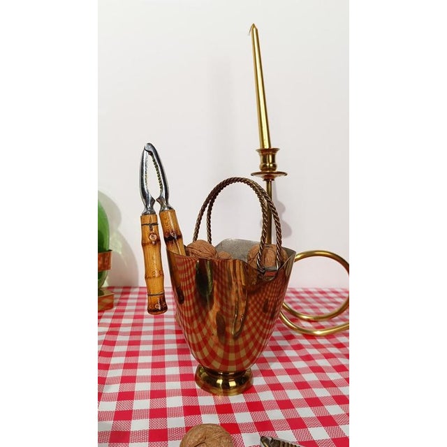 Pair of highly decorative vintage nutcrackers. Although their design has a distinctly tropical flair, these pieces were...