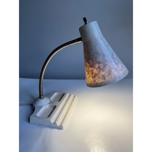 Bring iconic Mid-Century style to your home or workspace with this vintage Atomic-era gooseneck desk lamp. Featuring a...