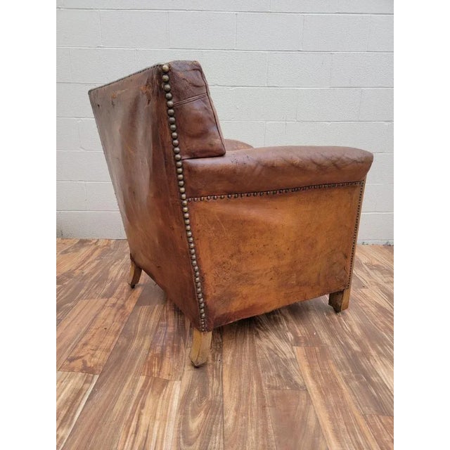 Vintage French Art Deco Distressed Brown Leather Club Chair The Lounge is being offered with it’s original distressed...