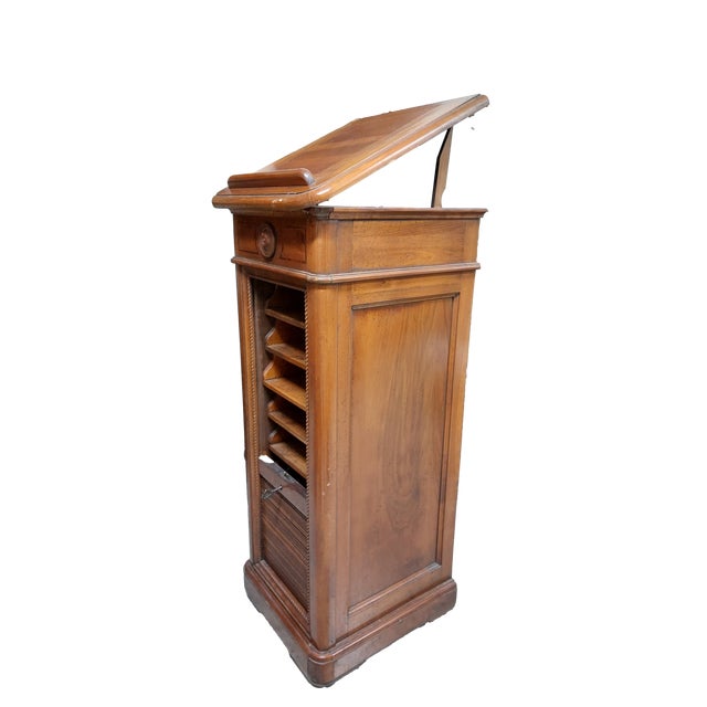Rolling shutter cabinet Elegant rolling filing cabinet, made of Italian walnut. Manufactured in 1910. Drawers crafted...