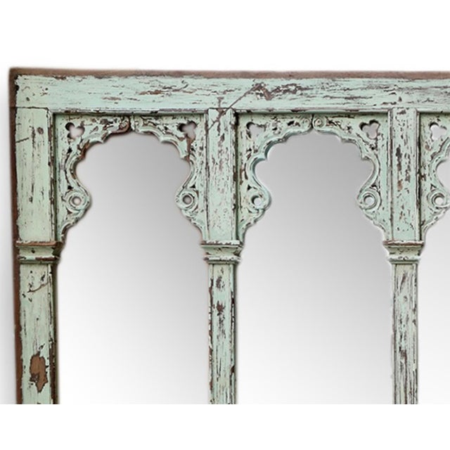 Strikingly beautiful antique extended carved wood architectural arched six-pane mirror. Originally used as a long open...