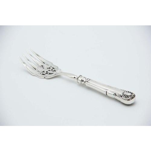 Fish Serving Fork in Cut Silver with Engravings, in Very Good conditions. Designed 1890 to 1919 This piece has an...