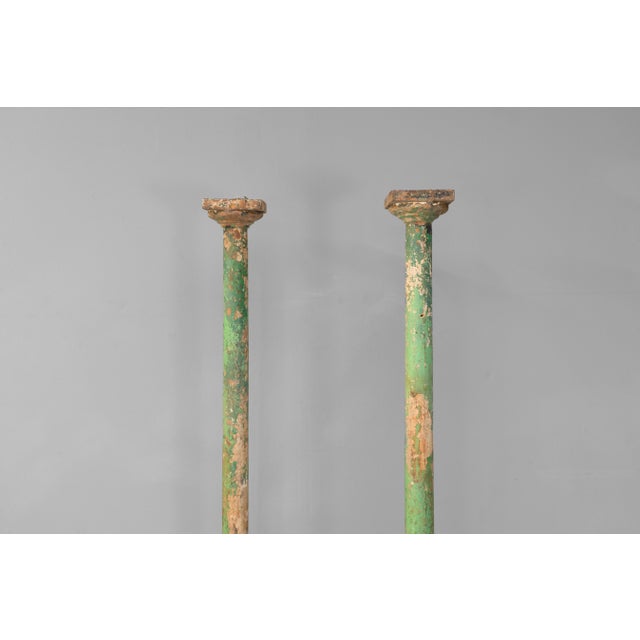 Pair of cast iron support pillars in aged green paint. U.K circa 1880.