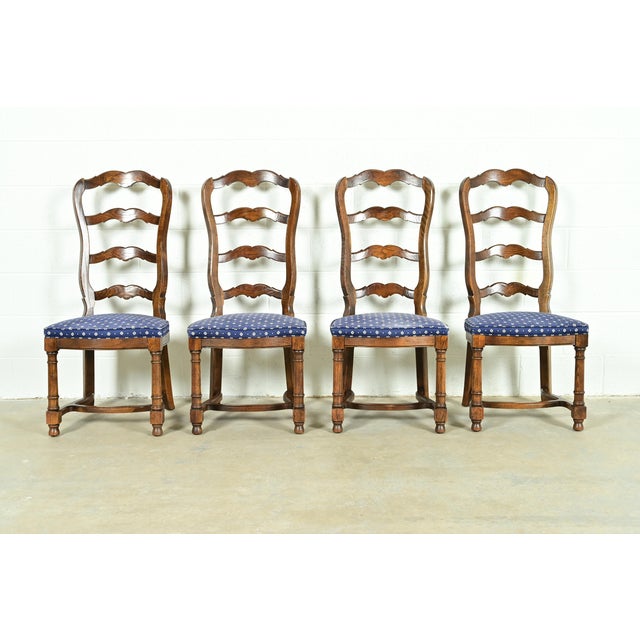 A gorgeous set of four French Country, French Provincial, or William and Mary style ladder back dining chairs By Century...