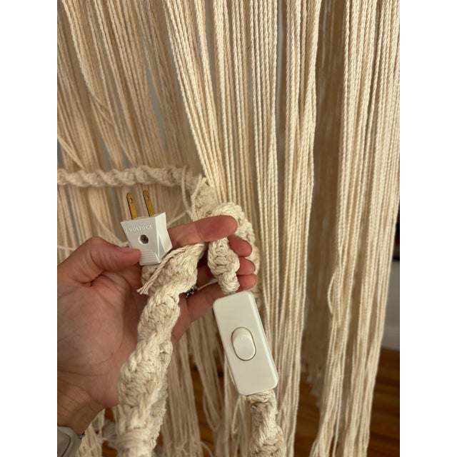 Soft warm ivory macrame fringe pendant. Plug in. Can be used as a wall sconce with arm.