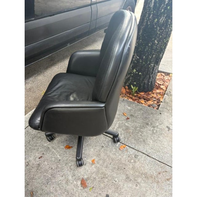 This set of 4 black modern leather executive swivel office chairs is designed for maximum comfort and style in any office...
