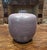 This mid-century modern West German art pottery vase features a matte Amethyst finish and a classic bulbous, apple-like...