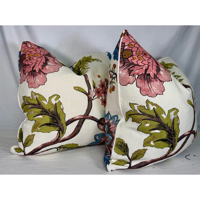Custom pair of 22" pillows covered in a bright floral on linen with touches of embroidery throughout the pattern. These...