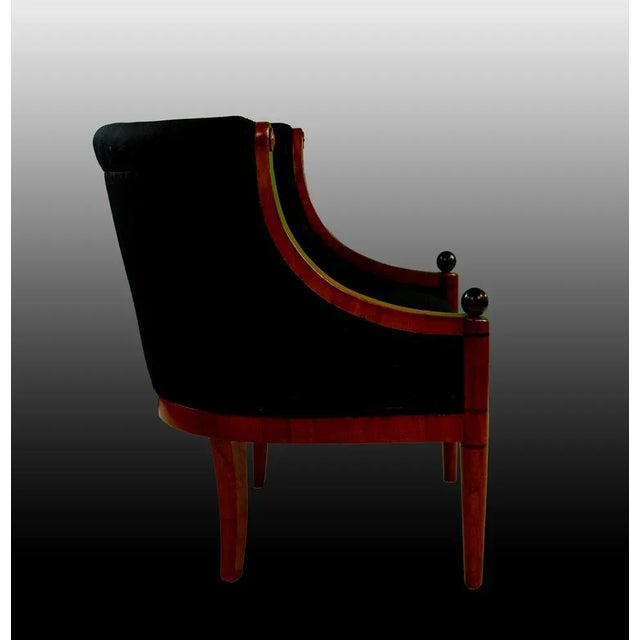 "Biga" armchair, typical model of the biedermeier era, small in size in cherry with legs to be soured by black balls,...