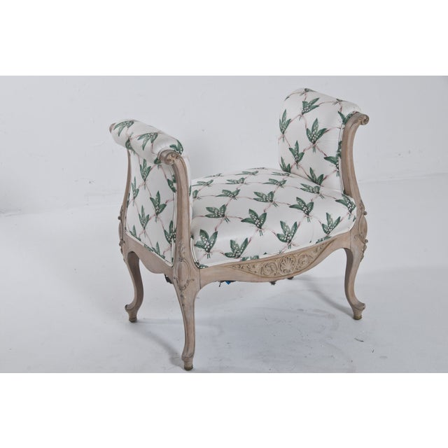 Take a petite seat on this carved wood frame bench. This piece features sweet cabriolet legs. 18" high seat