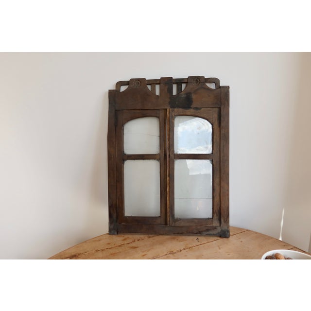 Antique double wooden shop window, full of charm and authenticity, ideal as a wall decoration in a country chic interior,...