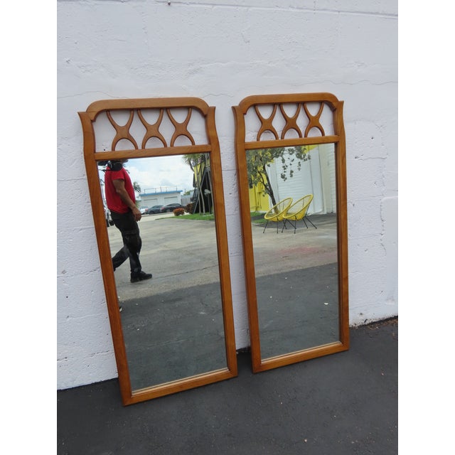 This gorgeous Pair of Mirrors is made of wood, and mirror. It was made by Red lion, and they are labeled. This Pair of...