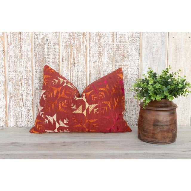 This colorful and luxurious Bagh Phulkari pillow features beautiful hand-done silk embroidery on top of a cotton fabric....