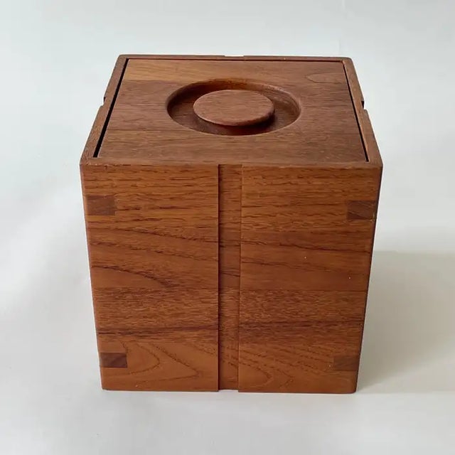 Mid Century Ice Bucket, rendered in beautifully carved and jointed solid teak wood, with a molded plastic waterproof...