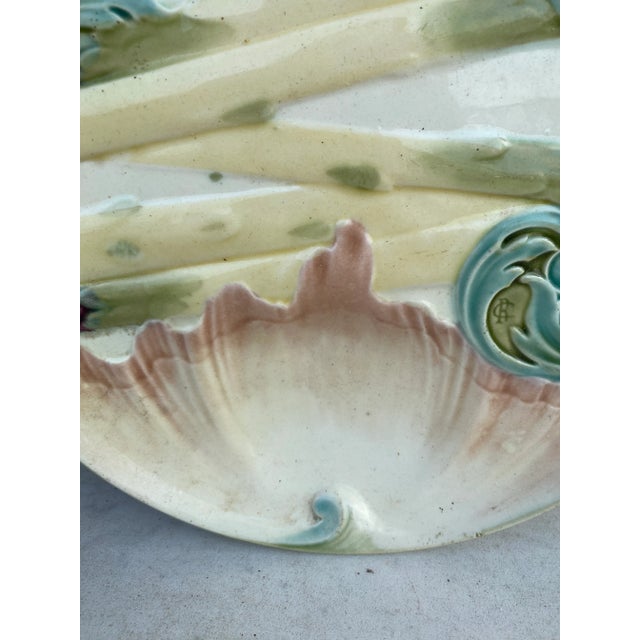 Majolica asparagus plate signed Keller et Guerin Luneville, circa 1880. This plate exist in different colors and sizes...