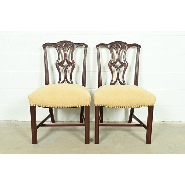 A gorgeous pair of Georgian or Chippendale style side chairs or dining chairs In the manner of Baker Furniture USA, Circa...