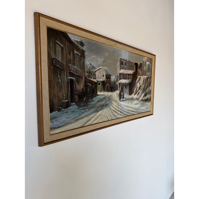 Capture the quiet beauty of a snow-covered European village with this vintage oil on canvas painting by A. Angivoni,...