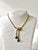 Rare vintage Crown Trifari gold-toned emerald and clear rhinestone necklace from 1949