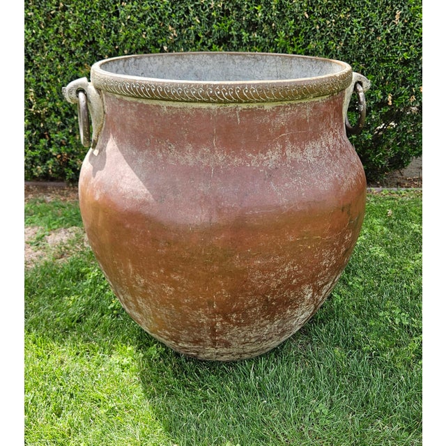 Vintage pot from North India traditionally used for water storage. Red patina on the outside, bronze/brass peacock handles...