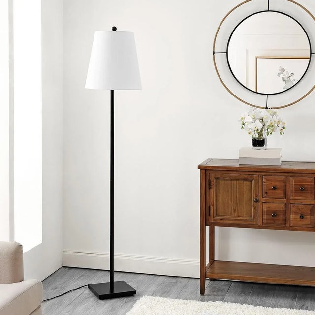 Introducing the Geralt floor lamp, a stunning 69-inch beacon of style and functionality. Crafted from iron, its sleek...