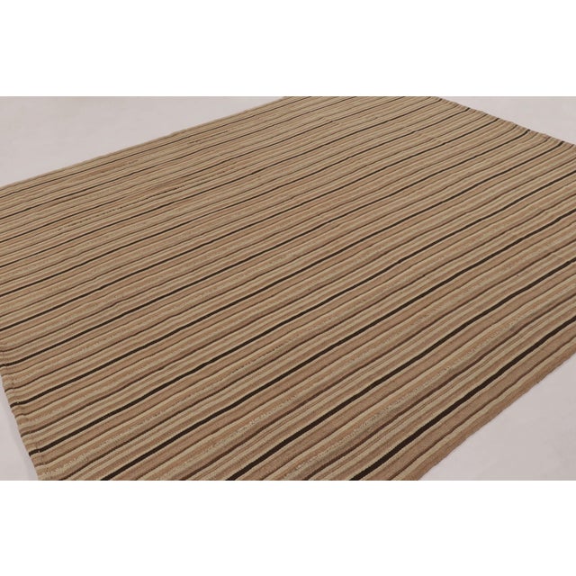 Handwoven in wool, this 9x10 contemporary Kilim is a refined piece from Rug & Kilim’s “Rez Kilim” collection, an...