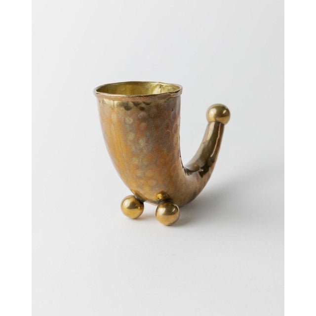 This vintage brass horn from Denmark, dating back to the 1930s, serves as both a decorative drinking vessel and an elegant...