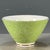 This is a striking vintage porcelain teacup, decorated in the famille rose palette with vibrant polychrome enamels. The...