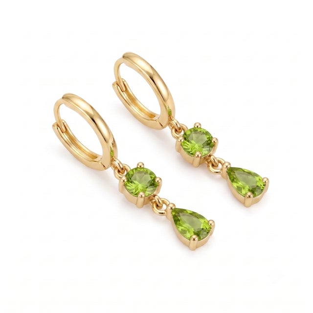 Bring fresh, botanical-inspired brilliance to your ensemble with these striking green gemstone earrings. Crafted with...
