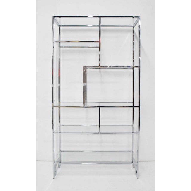 Elevate your living space with this stunning etagere by the Design Institute of America. Beautifully crafted with chrome...
