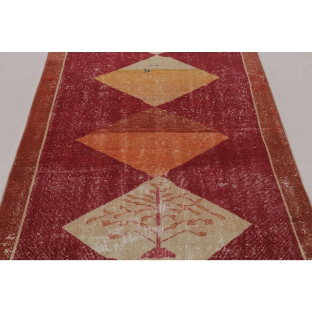 This vintage rug is a 4x7 Turkish distressed piece, made with hand-knotted wool circa mid-20th century. It is an exciting...