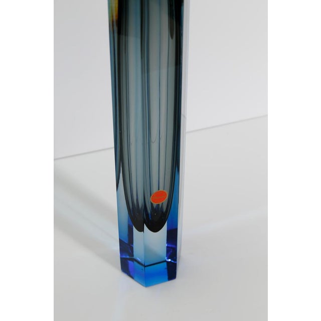 A faceted Murano sommerso glass vase handcrafted in Italy during the 1990s, showcasing exceptional optical depth through...