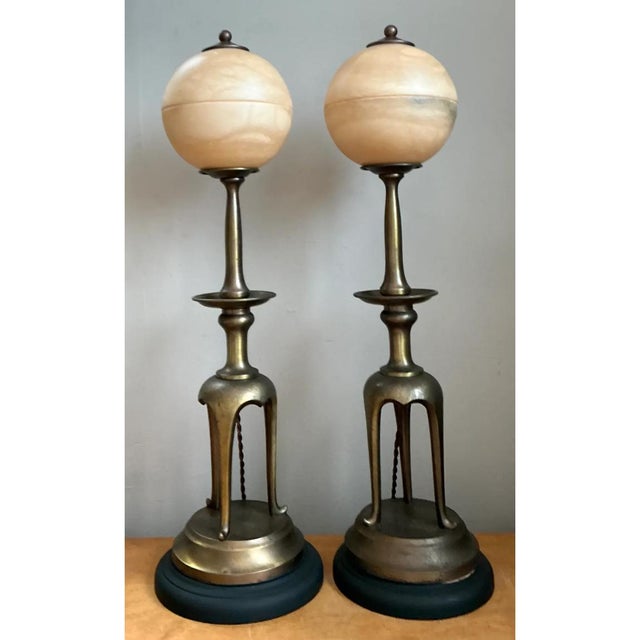 This pair of vintage table lamps joins cast brass with luminous alabaster in a tall, Asian-inspired silhouette. Each lamp...