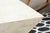 This post modern coffee table showcases a bold architectural form crafted from polished tesselated stone in soft, neutral...