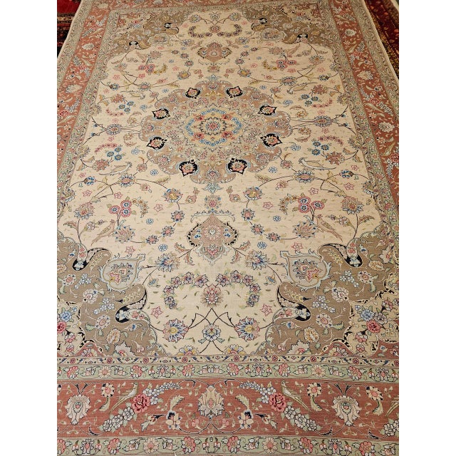 "An exceptionally fine vintage Persian Tabriz rug, masterfully hand-knotted in the 4th quarter of the 20th century. This...
