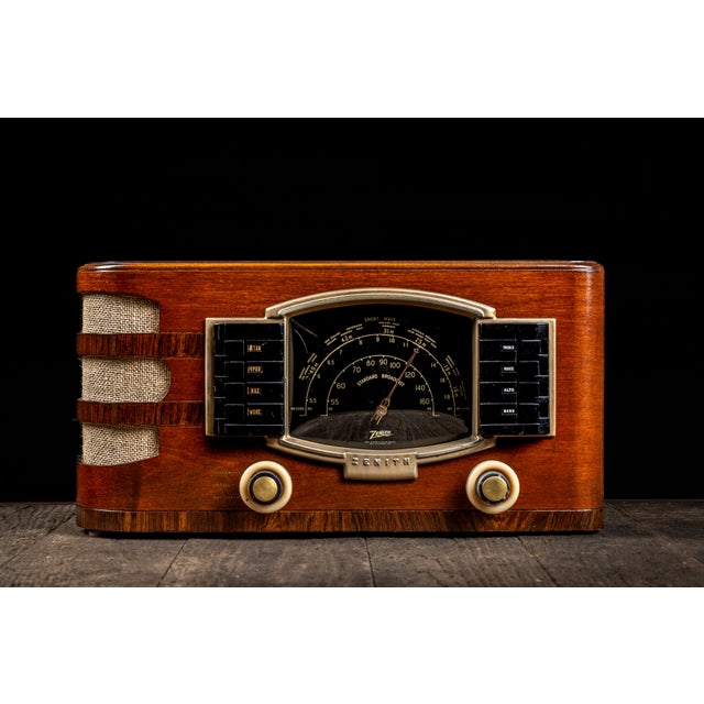 c. 1940s; Zenith Radio Corp. - Chicago, IL Streamline Moderne-inspired tabletop radio. Features robust tone control and...
