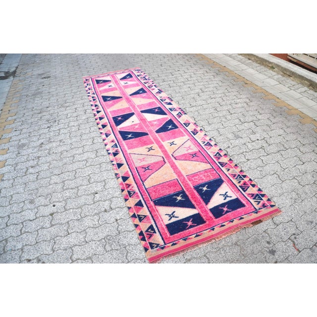 This is a vintage Turkish Oushak rug from the 1960s. The piece was hand-knotted.