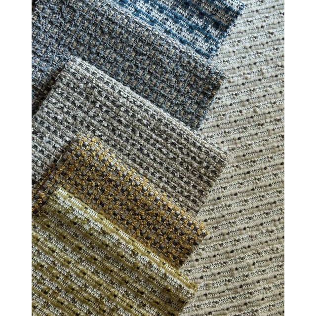 Altan is a boucle check with a charcoal base creating a wonderfully textured open boucle feel. 94% Recycled Polypropylene...