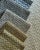 Altan is a boucle check with a charcoal base creating a wonderfully textured open boucle feel. 94% Recycled Polypropylene...