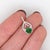 This beautiful pendant features a sparkling light green 0.56ct tsavorite pendant with natural earth-mined diamonds in...