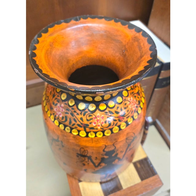 Very rare and unique wooden vase. Thick painted folk art piece.It has a tribal like feel, depicting a silhouette of a...