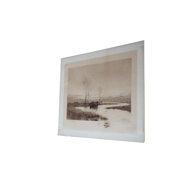 Antique black and white riverscape / landscape etching featuring a large rowboat in the marsh. Signed in pencil by both...