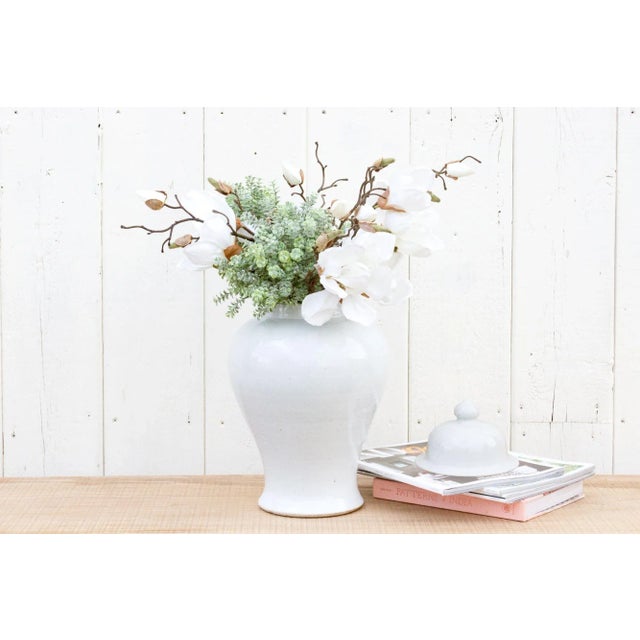 This tall off-white glazed Jar is an impressive container for flowers since the interior is glazed as well and it can hold...