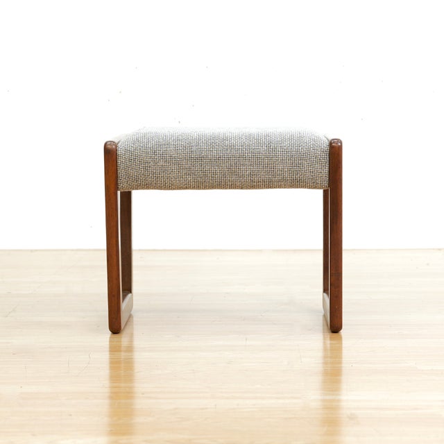 This mid-century stool was produced in England during the 1960s. Made from teak it has a minimalist Scandinavian...