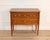 A refined Louis XVI–style chest of drawers crafted in cherry wood and cherry veneer, distinguished by its architectural...